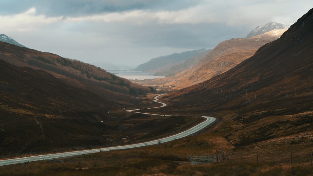 Winding road at the foot of hills